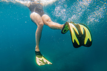 woman in flipper view underwater beach vacation