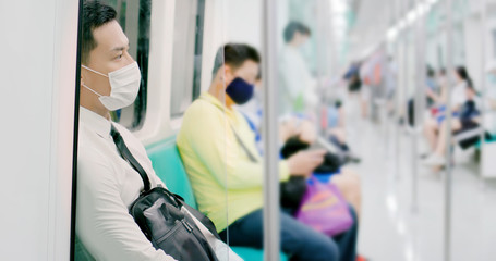 man with mask in metro