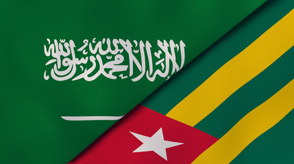 The flags of Saudi Arabia and Togo. News, reportage, business background. 3d illustration
