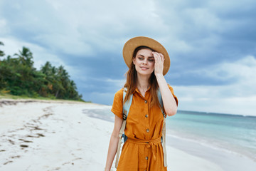 young woman in hat on the beach