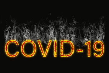The designation of a Covid 19 virus as burning letters on a black background with smoke