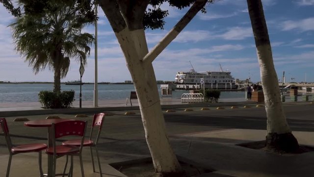 A ship docked near the beach.