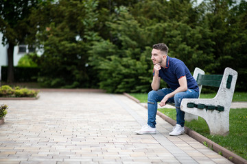 Portrait of a Young Man Outside in Park