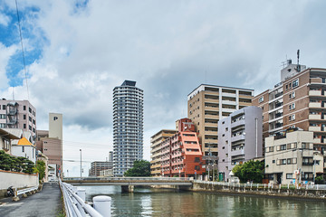 Fototapeta na wymiar Japanese canal and modern buildings