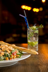 Chicken salad with rocket, cherry tomatoes, smoked cheese and crunchy sesame sticks