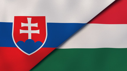 Fototapeta premium The flags of Slovakia and Hungary. News, reportage, business background. 3d illustration