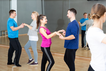 Young couple practicing active dance in pair