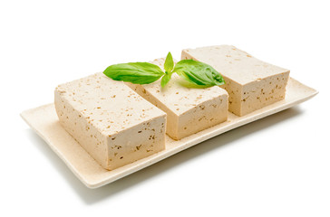 Plate with tasty tofu cheese on white background