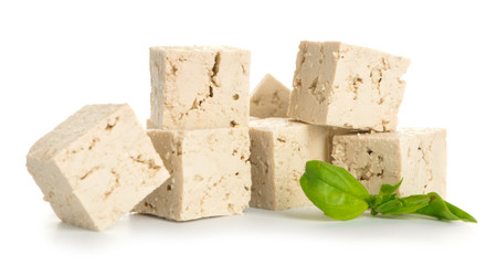 Cut tofu cheese on white background