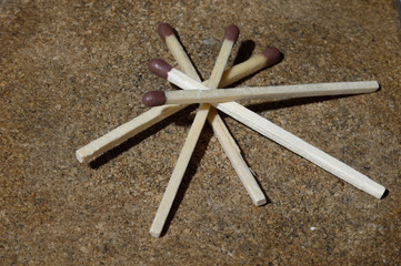 Match collection - five matches on a grainy background