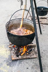 Romanian traditional food prepared at the cauldron on the open fire