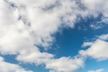 the blue sky with white clouds