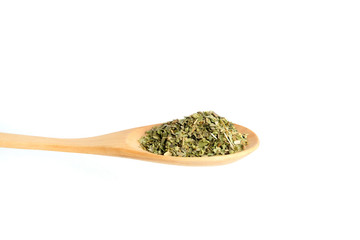 Top view oregano on wooden spoon– isolated on white background