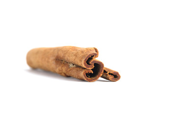 Closeup dried cinnamon stick isolated on a white background