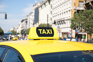 Checker taxi by car. Taxi in the city