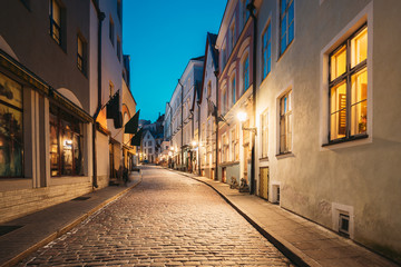 Fototapeta na wymiar Tallinn, Estonia. View Of Old Architecture On Dunkri Street In Evening Night Illuminations