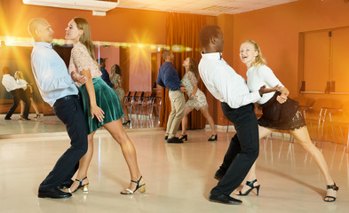 Couples enjoying boogie-woogie