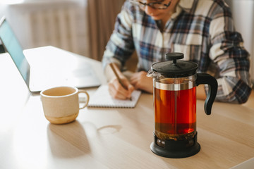 Young woman working with tea on a table