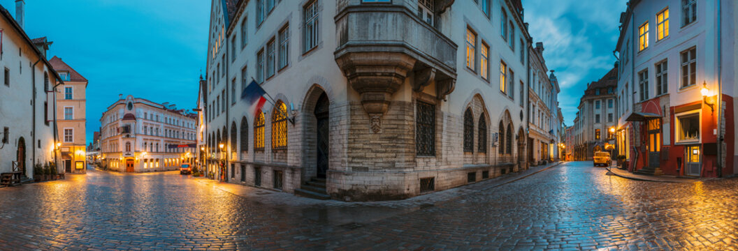 Tallinn, Estonia. Night Evening Panorama Panoramic View Of Old Vana turg And Suur-Karja Street In Tallinn