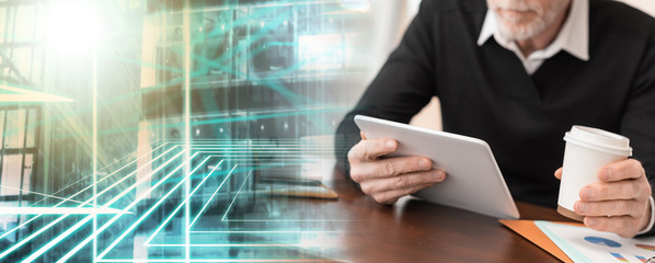 Businessman working on digital tablet at office; multiple exposure