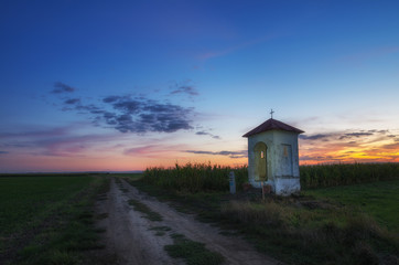 Old roadside chapel in the middle of fields.