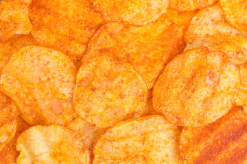 background of potato crisps snack with paprika and sour cream flavor
