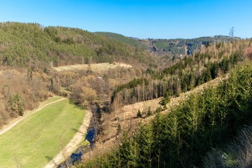 View of the Bobruvka River valley in the Czech Republic - Highlands. Wooded hills. Quiet place. A beautiful day.