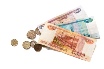 Russian paper money and coins on a white background