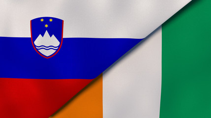 The flags of Slovenia and Ivory Coast. News, reportage, business background. 3d illustration