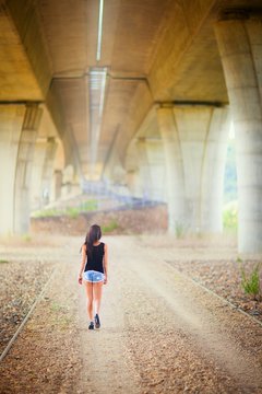 Beautiful young woman in exterior, no face. Amazing sunny day.