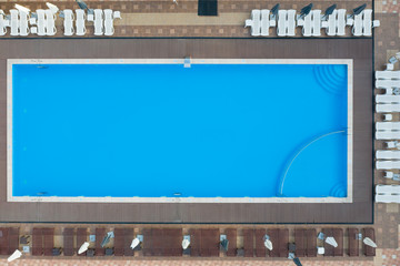 Swimming pool at the hotel aerial view. Aerial photography of a vacation spot with a swimming pool.