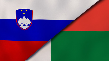 The flags of Slovenia and Madagascar. News, reportage, business background. 3d illustration