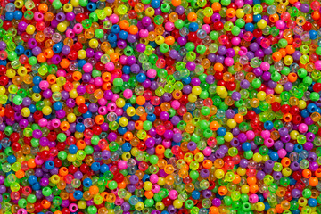 Lots of little colored beads. Background of colored beads.