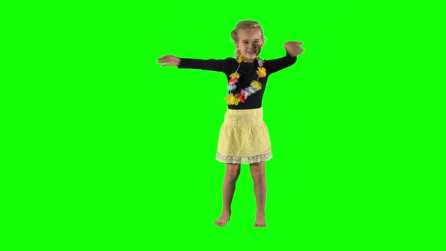 Happy little girl with blond pigtail hair, dancing in the studio. Chroma key