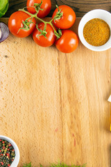 Wooden board with clear space. Around tomato and dill, olive oil, spice, peper, avocado, green...