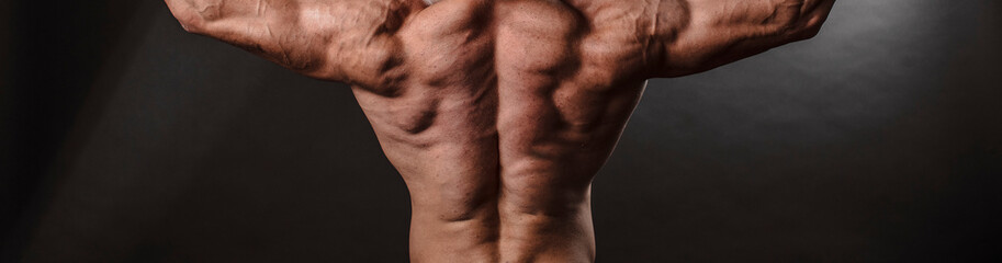 Fototapeta premium Strong man back. Strong body. Brutal. Motivation. 