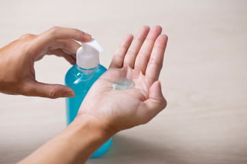 using hand sanitizer gel cleaning hands at home