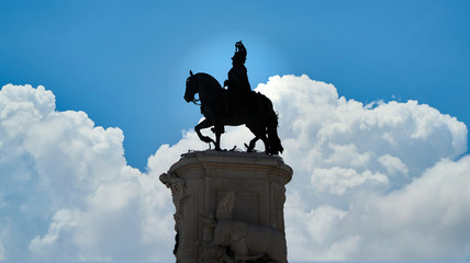Lisbon, Portugal - November 2019: Silhouette of Equestrian statue of King John I in the Praca da Figueira square