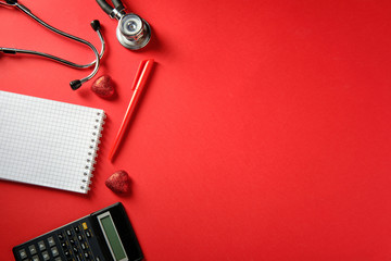 Notepad, stethoscope, calculator, treatment spending symbols