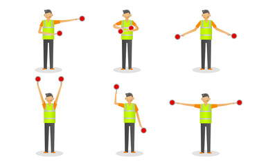 Set of young traffic controller in special costume with signs during work © greenpicstudio