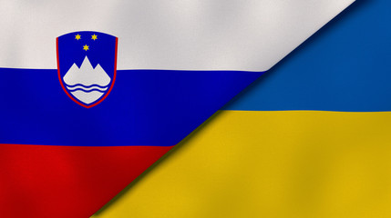 The flags of Slovenia and Ukraine. News, reportage, business background. 3d illustration