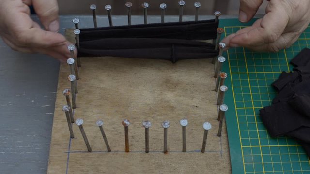 making a tawashi Japanese sponge from cut up leggings on home made loom,  pastime at home. diy.