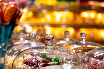 Turkish delight under a glass bell on a display case