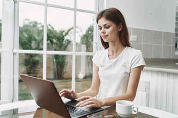 young woman working on laptop