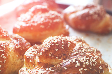 Fresh twisted buns with sesame seeds in the early morning. Morning sunshine