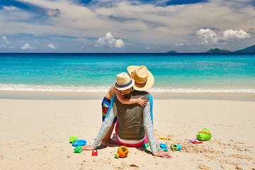 Toddler boy on beach with father