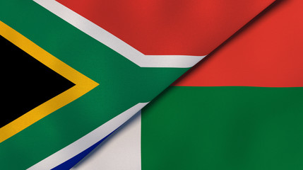 The flags of South Africa and Madagascar. News, reportage, business background. 3d illustration