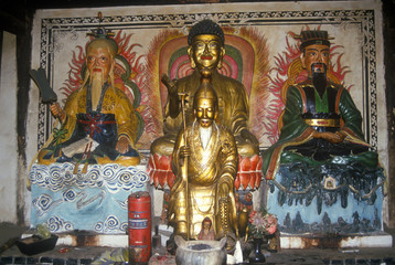 Statue of Buddha and Confucius in original Ancestor Temple in Dali, Yunnan Province, People's Republic of China