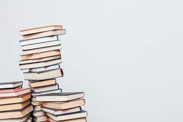 lots of stacks of educational books to teach in the library on a white background