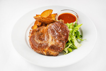 steak with baked potatoes and salad